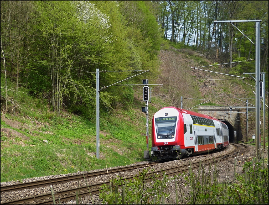 . The IR 3737 Troisvierges - Luxembourg City is leaving the tunnel Cruchten on May 3rd, 2013.