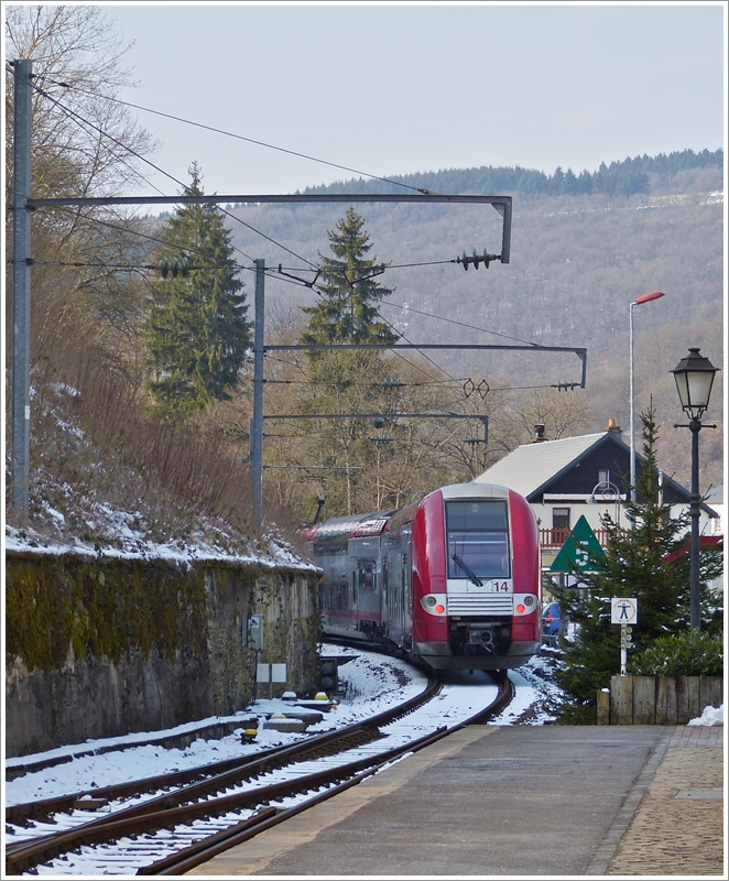 . The RB 3213 Luxembourg City - Wiltz is leaving the station of Kautenbach on March 25th, 2013.