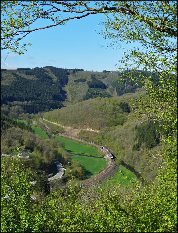 . The RB 3235 Wiltz - Luxembourg City is running through the nice valley of the river Wiltz just before arriving in Kautenbach on May 5th, 2013.