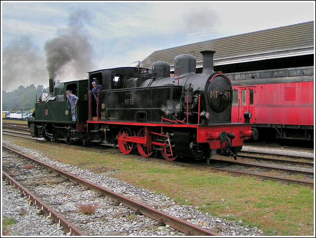 . The steam locomotive MF83 (030T) taken in Treignes on September 23rd, 2006. It was built by La Meuse-Lige in 1916. The MF83 comes from the coalmines Monceau-Fontaine at Monceau. It was made for shunting and had a simple concept. This engine was the last steam engine to be used by the mines. It was moved to Mariembourg by own means on 24th may 1980 and is property of CFV3V. 