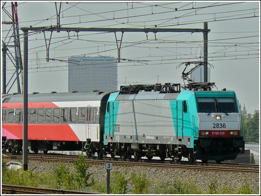 . The TRAXX HLE 2836 is hauling a IC Brussels - Amsterdam through the station Antwerpen-Luchtbal on June 23rd, 2010.