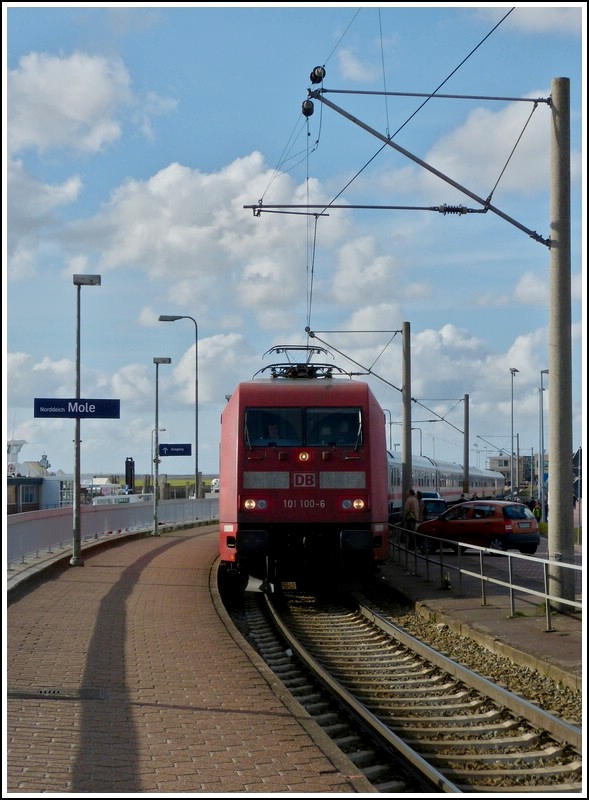 101 100-6 with IC wagons is leaving the station of Norddeich Mole on May May 5th, 2012.