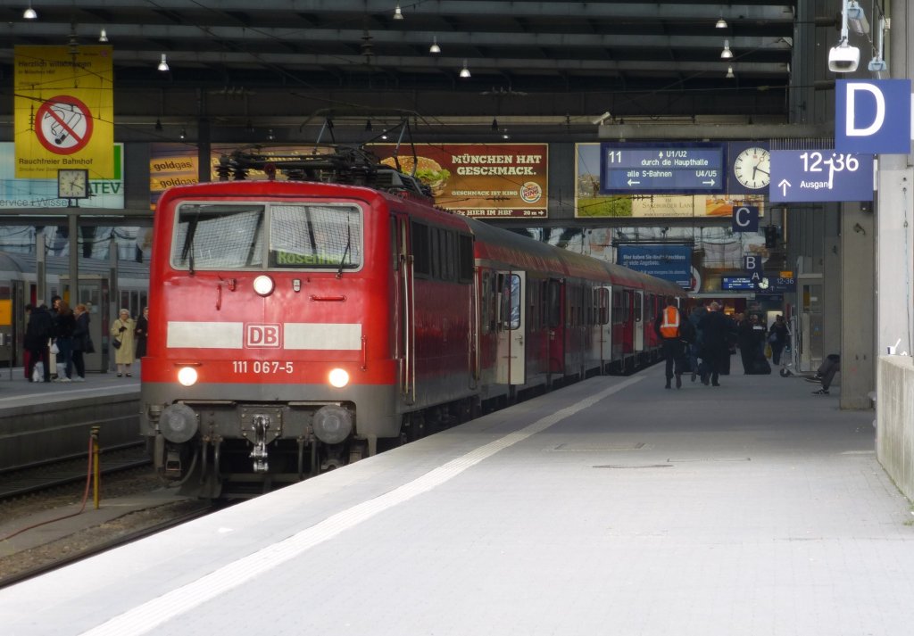 111 067-5 is standing in Munich main station on May 23rd 2013.