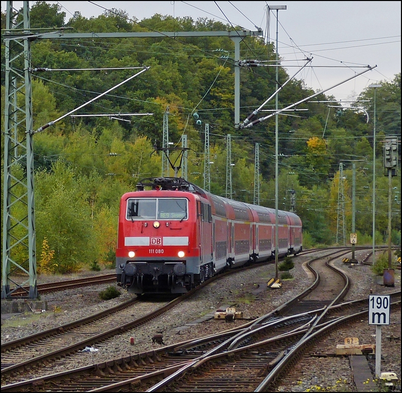 111 080 is hauling the RE 9 (Rhein-Sieg-Express) into the station of Betzdorf (Sieg) on October 13th, 2012.