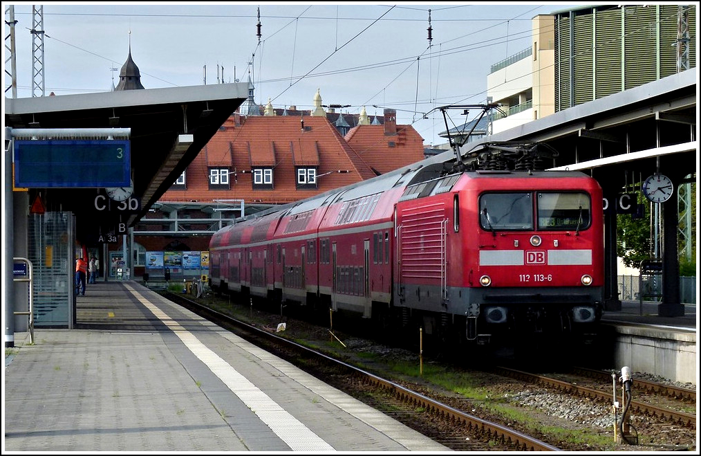 112 113-6 is heading a push-pull train in Stralsund on September 20th, 2011.