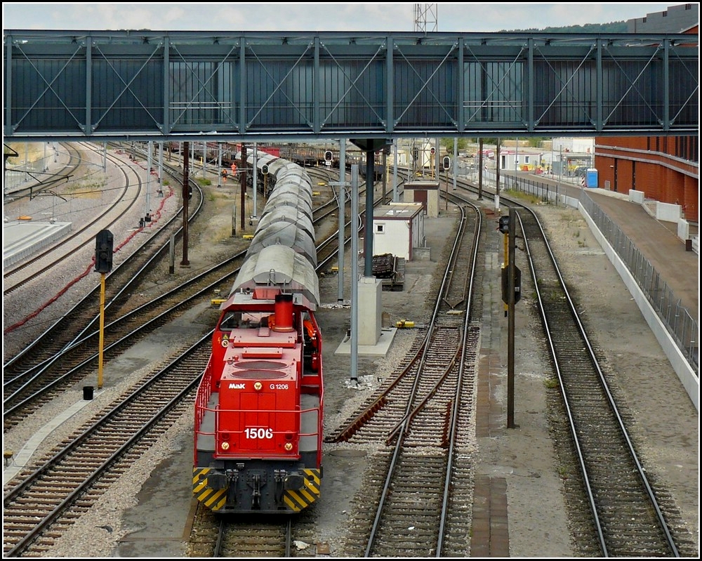 1506 is hauling a freight train through the station Belval Université on August 6th, 2010.