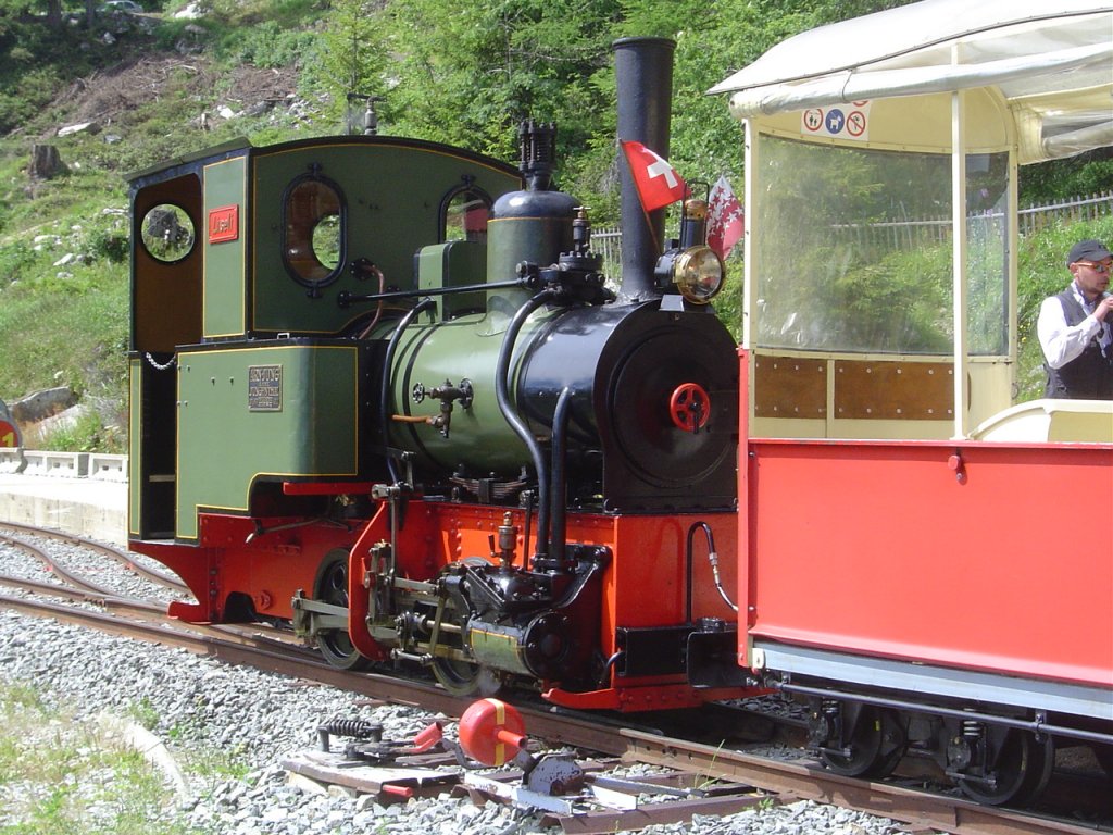 2 ft gauge steam engine  Liseli  (Jung No 1693, built 1911) in service on the high alpin panoramic railway of  Parc d'Attractions du Chatelard (VS)  in Switzerland.
In the station  Les Montuires  on 1'800 metres about sea level. Train is ready to leave in direction  Pied du Barrage . 02 July 2011