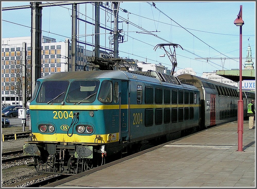 2004 with bilevel cars is leaving the station of Luxembourg City on February 3rd, 2008.