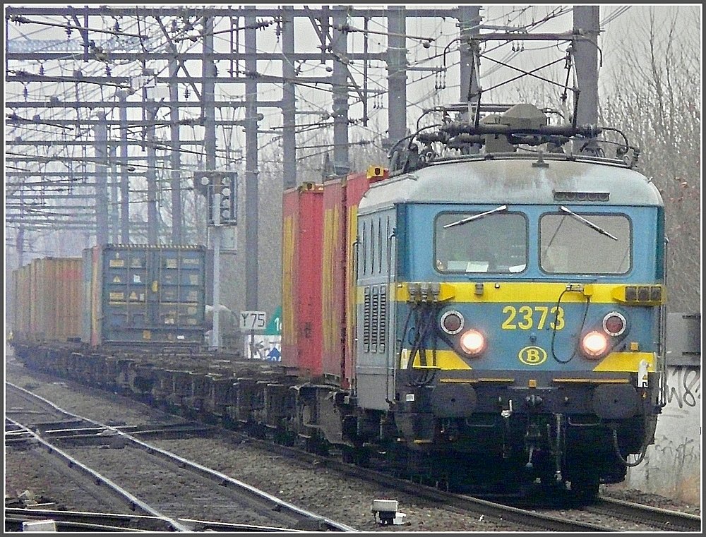 2373 is hauling a freight train through the station Gent Sint Pieters on February 27th, 2009.