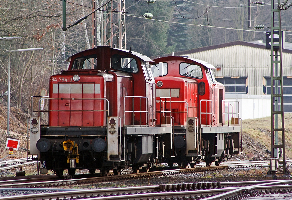 294794-3 and 294874-3 (two repowers V 90) of the DB Schenker Rail are parked on 14.01.2012 under the Langenauer bridge in Kreuztal.