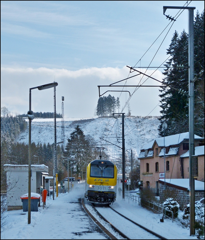 3011 is hauling the IR 112 Luxembourg City - Liers through the stop Maulusmhle on February 9th, 2013.