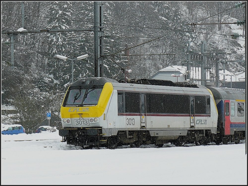 3013 is hauling the IR Luxemburg-Liers out of the station Troisvierges on March 22nd, 2008.