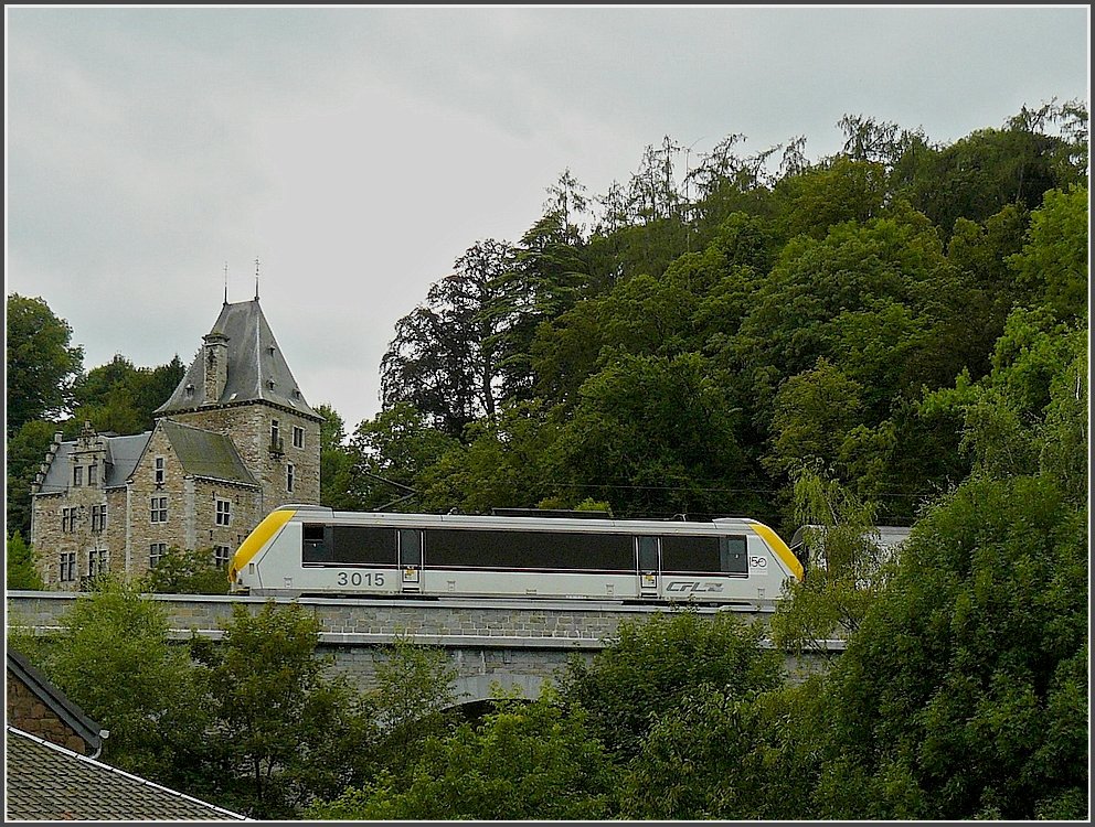 3015 heading the IR Liers-Luxembourg City is crossing the Amblve bridge at Remouchamps (B) past the romantic castle Montjardin on August 12th, 2009.