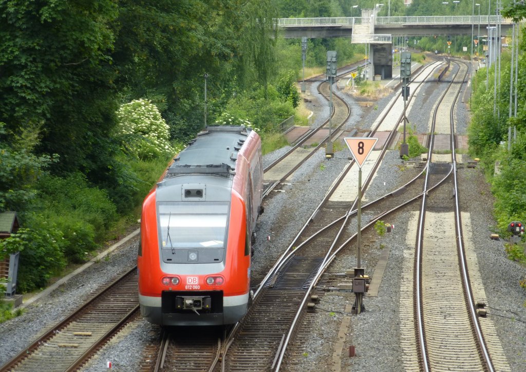 612 060 is driving in Oberkotzau on June 30th 2013.