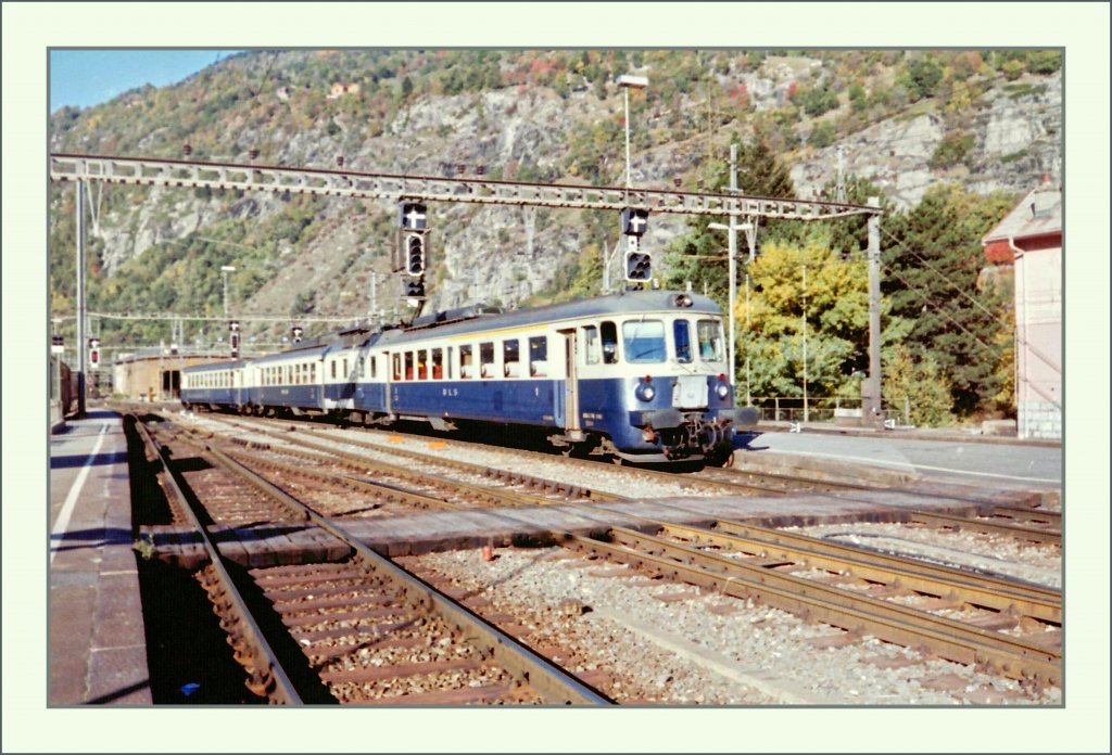 A BLS ABDE 4/8 on the local service on BLS Sdrampe (Goppensten - Lalden - Brig) is arriving at Brig. 
17.10.1994/scanned negative