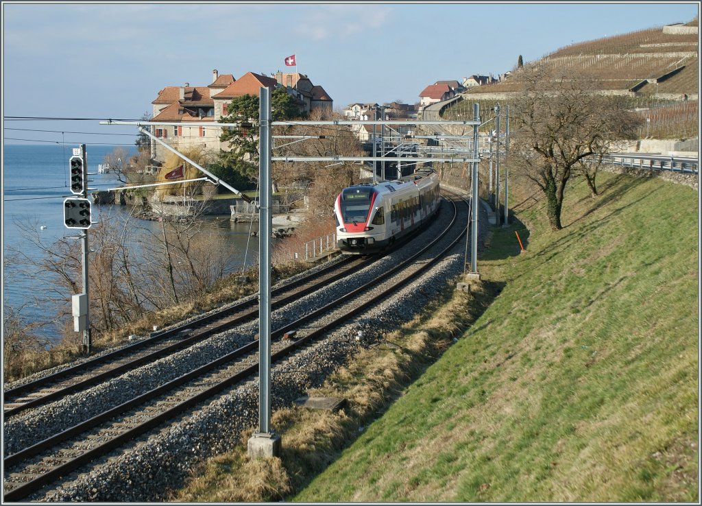 A  Flirt  to Allaman is approaching Rivaz Station. 
22.01.2011