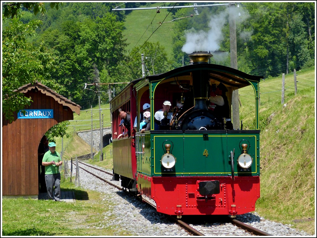 A heritage train of the Blonay Chamby railway taken at the stop Cornaux on May 27th, 2012.