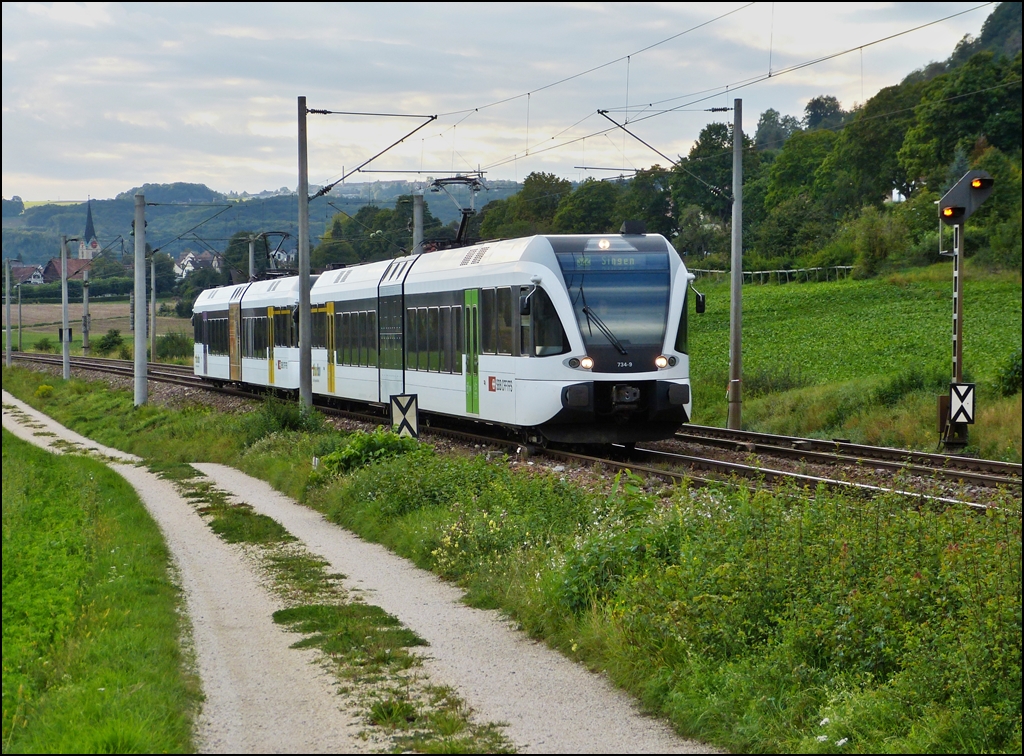 A local train from Schaffhausen (CH) to Singen (D) is running through Bietingen on September 13th, 2012.