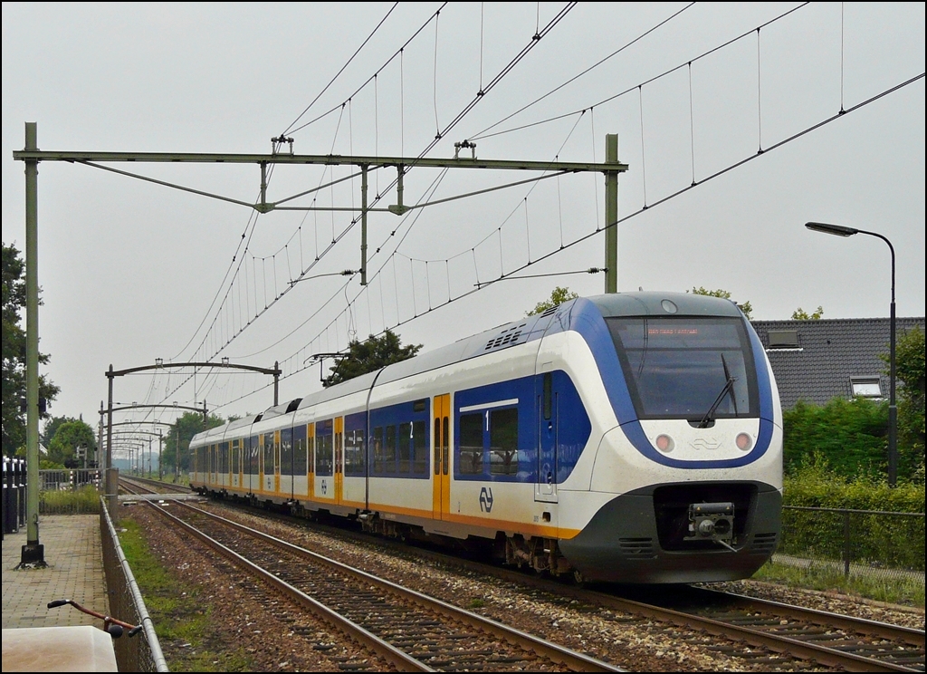 A local train to Den Haag Central is leaving the station of Sevenbergen on September 2nd, 2012.