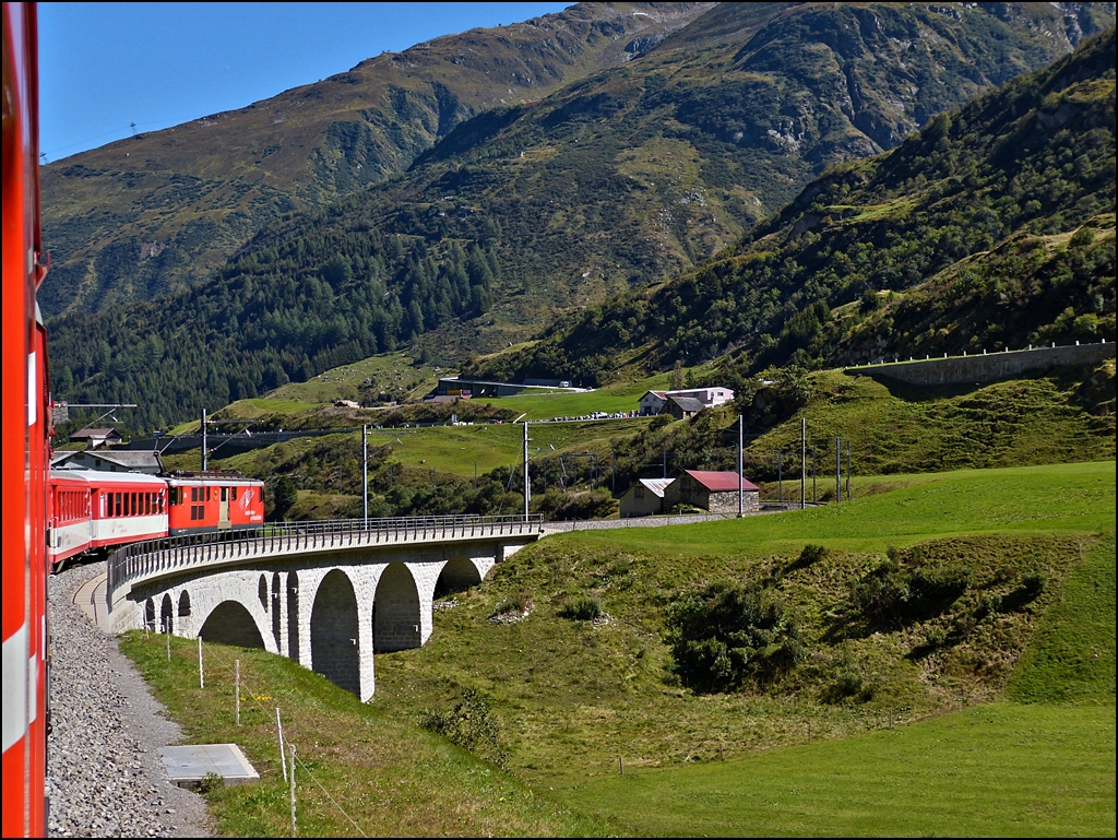 A MGB local train is running on the Furka Reuss bridge near Hospental on September 16th, 2012.