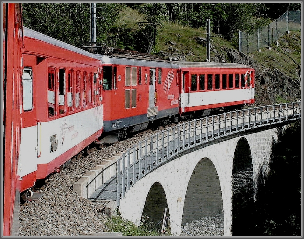 A MGB local train is running near Hospental on August 1st, 2007.