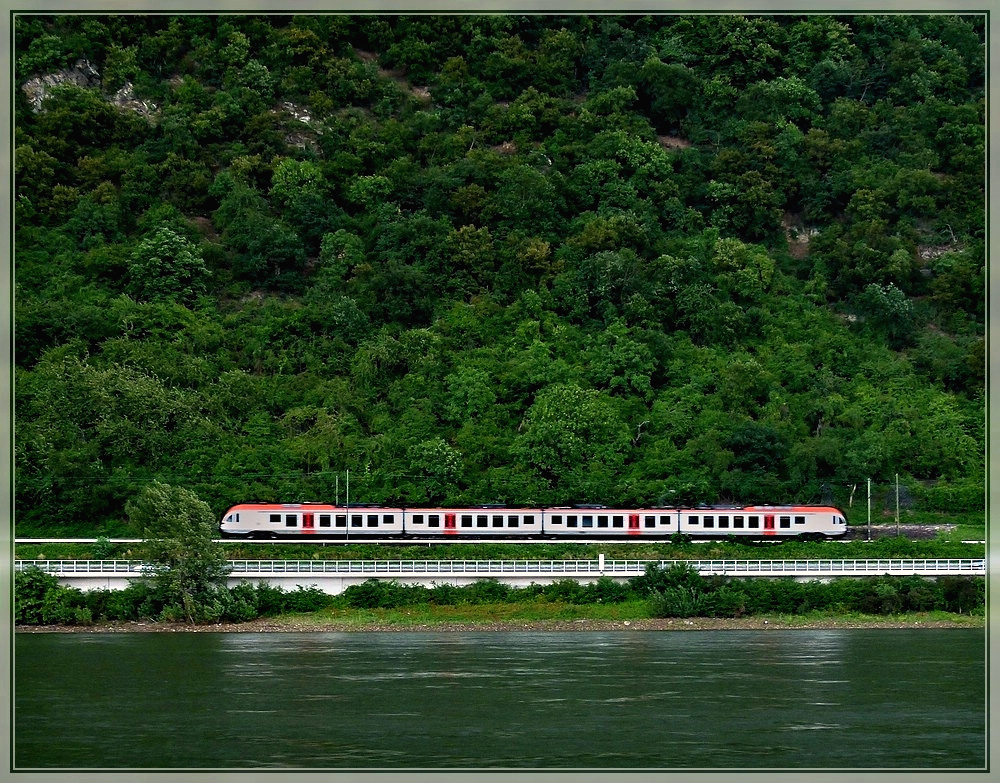 A VIAS Flirt is running on the right Rhine track near Braubach on June 24th, 2011.