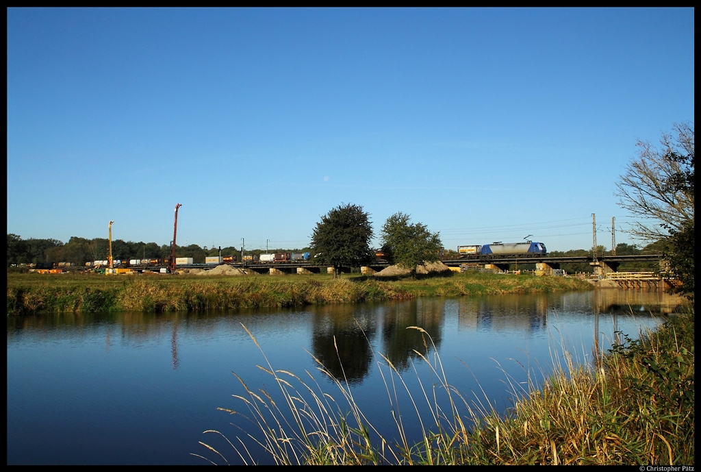 Alpha Trains 145-CL 203 is passing the Ehle bridge near Biederitz with a Container Train. (2011-10-15)