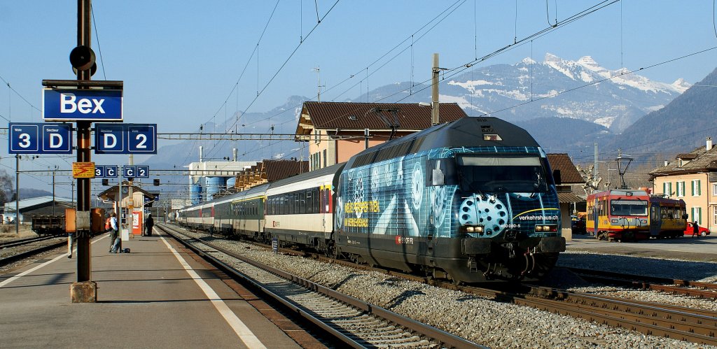 Bex is the connecting Station to the BVB train to Villars. 
SBB Re 460 080-5 and in the background the BVB Local train. 
08.02.2010
