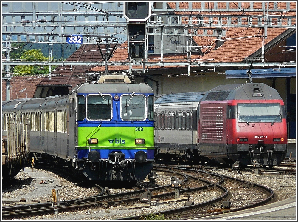 BLS Re 420 509 is arriving, while SBB Re 460 014-4 is leaving the station of Spiez on July 29th, 2008.