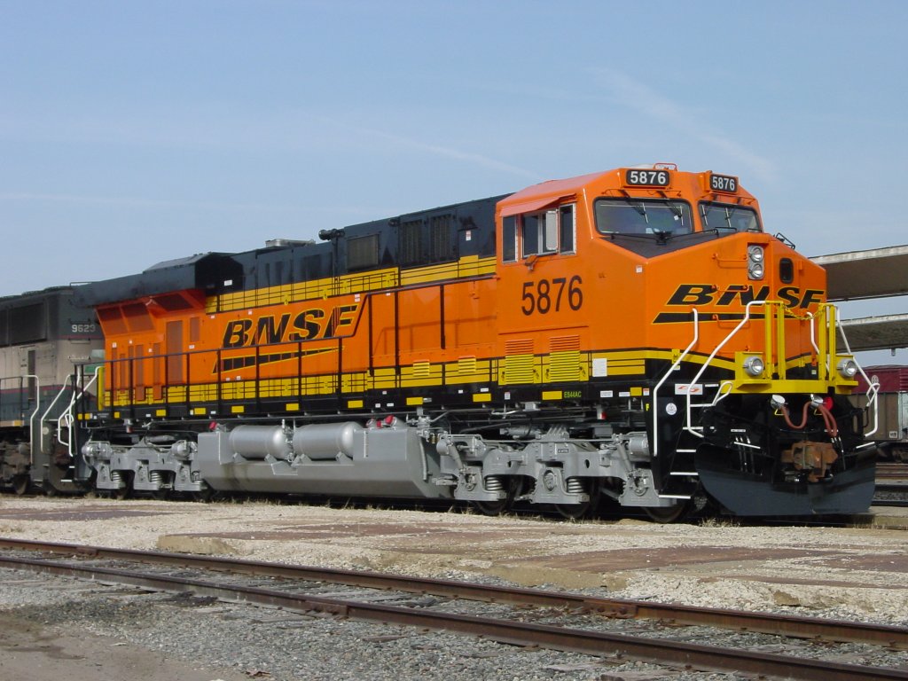 BNSF 5876 sits coupled to BN 9623 at the Burlington, Iowa depot while its coal train is being unloaded at the power plant south of town on 27 Feb 2006.