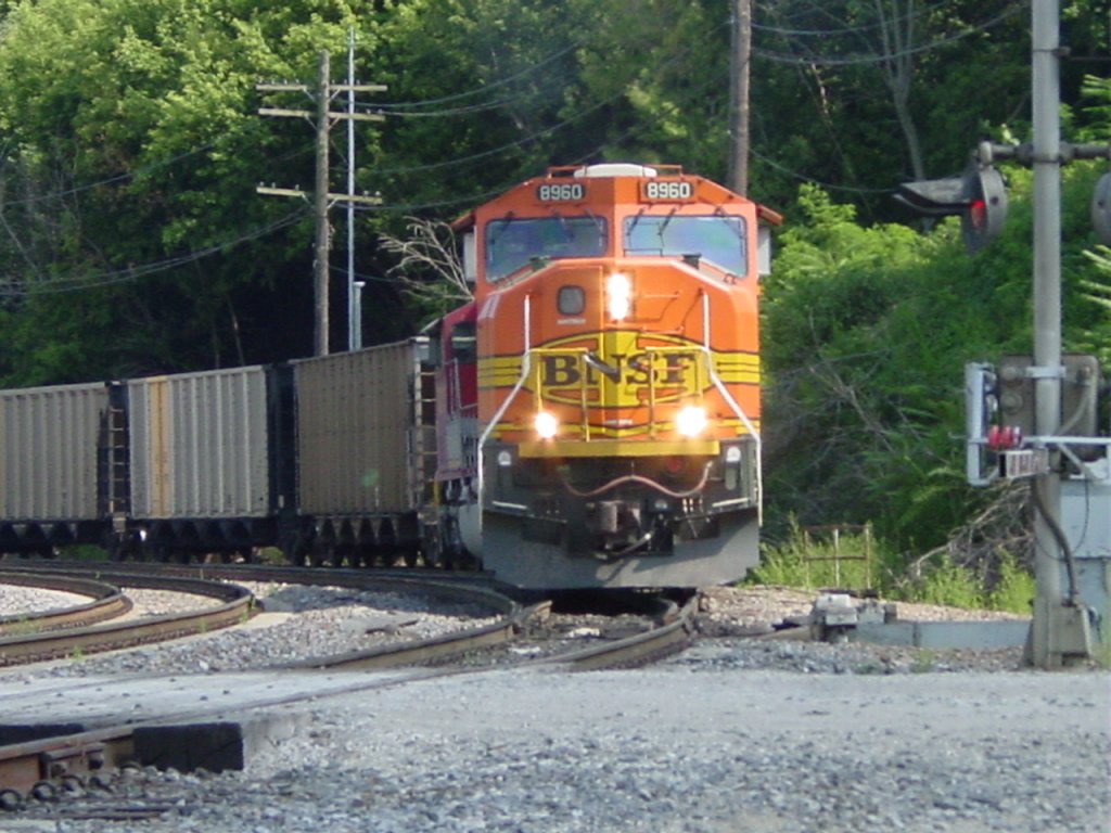 BNSF 8960 pulls its empty coal train off of the  K Line  which runs along the Mississippi River and onto the Main Line near the 205 mile marker in downtown Burlington, Iowa on 30 July 2003.