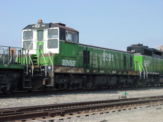 Burlington Northern 6291, now wearing BNSF letters at the bottom of the cab, appears at the Burlington, Iowa yard doing switching chores. 22 Oct 2002.