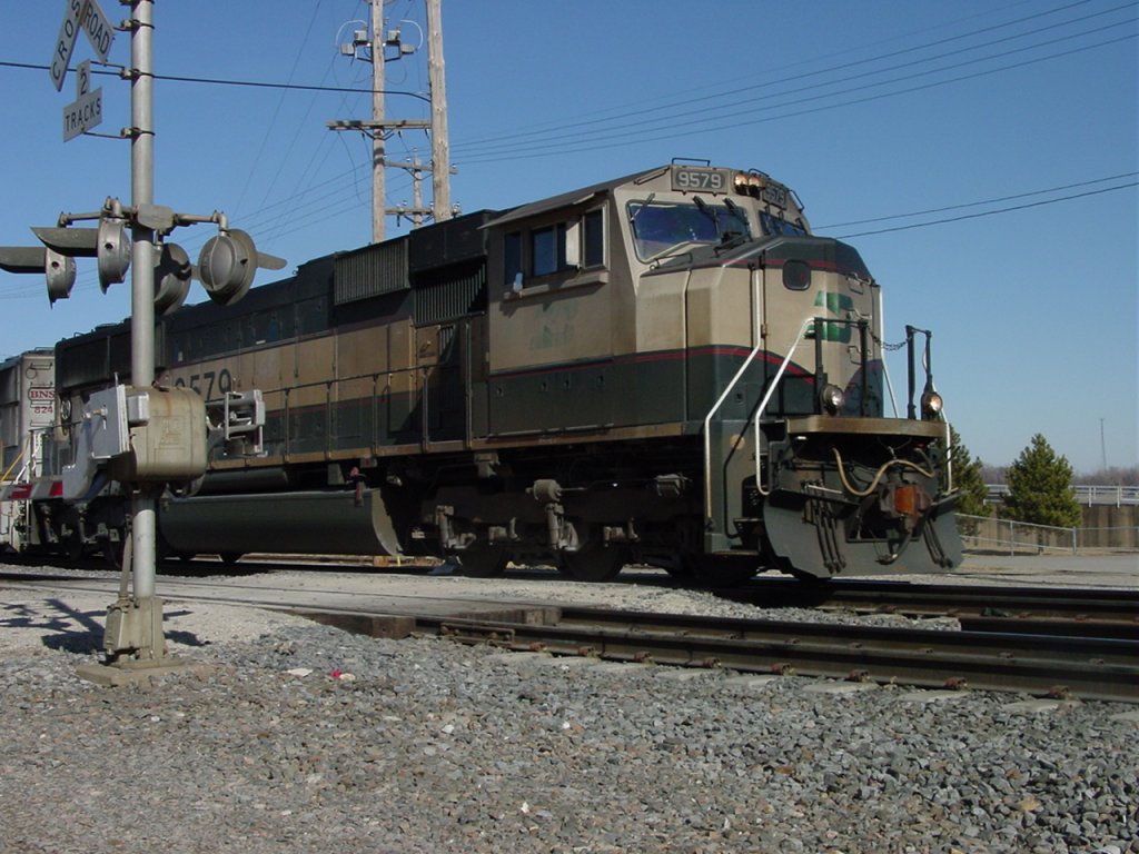 Burlington Northern 9579 rolls thru te South Street crossing on its way to the Mississippi River bridge and Illinois. 13 Feb 2003.