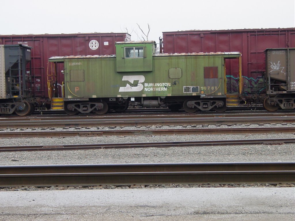 Burlington Northern caboose 10781 sits in the yard at Burlington, Iowa on 27 Feb 2006. These units are routinely used between Burlington and Galesburg, Illinois.