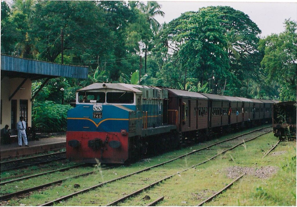 CLASS M4 ALCO Bombardier loco is stopped at a small railway station on its way to Vavuniya on the main line.