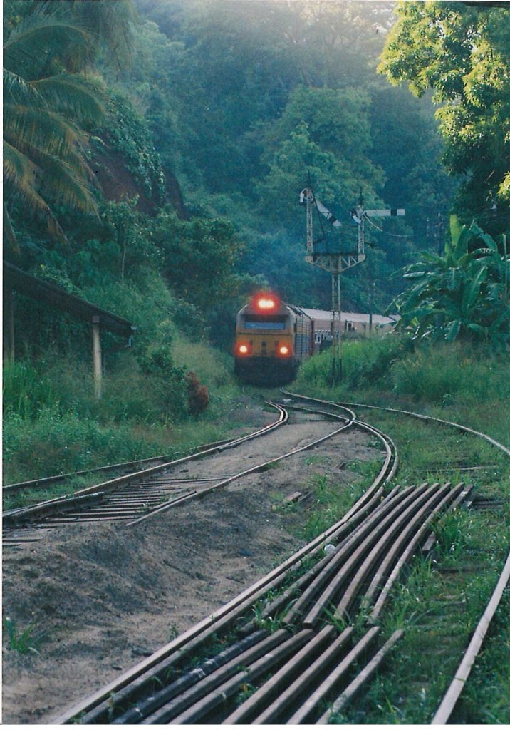 Class M9 French ALSTOM RUSHTON DIESEL is approaching Ihala Kotte Station at Kadugannawe pass which is bound to Colombo on downhill in early hours of the day on 12th Sep 2012.  The train is just passing the semaphore signal post. (Note – inner signal is on ) 
	

