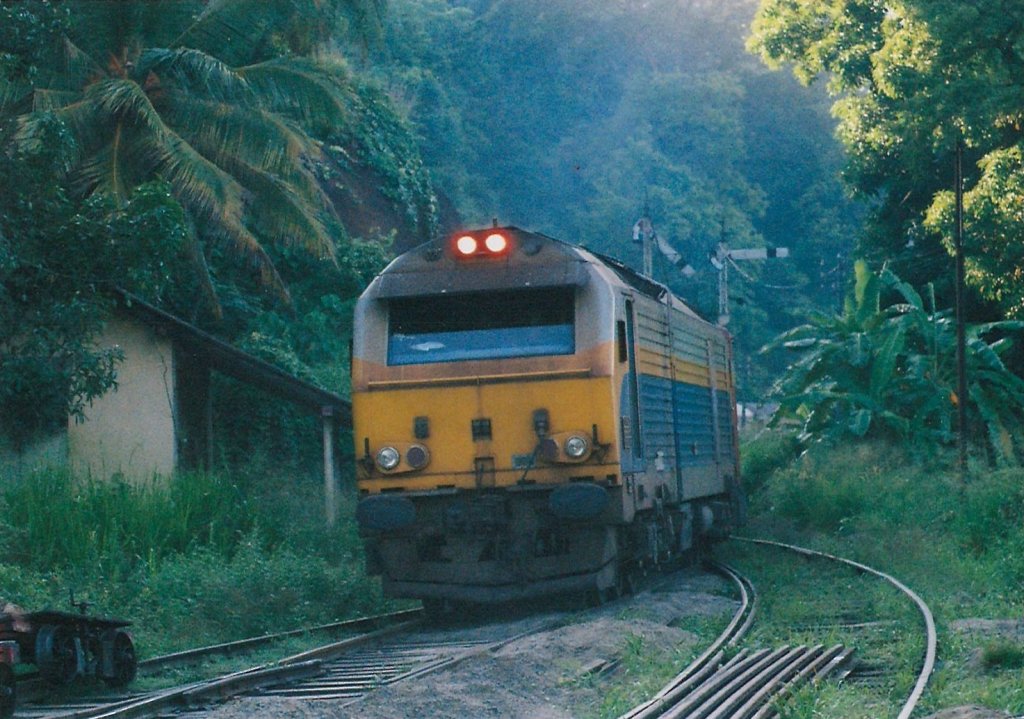Class M9 French ALSTOM RUSHTON DIESEL is on down hill approaching Ihala Kotte Station in the early hours of the day on 12th Sep 2012. Semaphore signal post with inner signal on is visible in the picture. 
	

