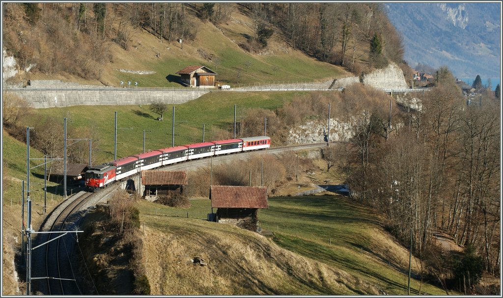 De 110 021-3 with The IR 2214 between Niderried and Ringgenberg. 09.02.2011