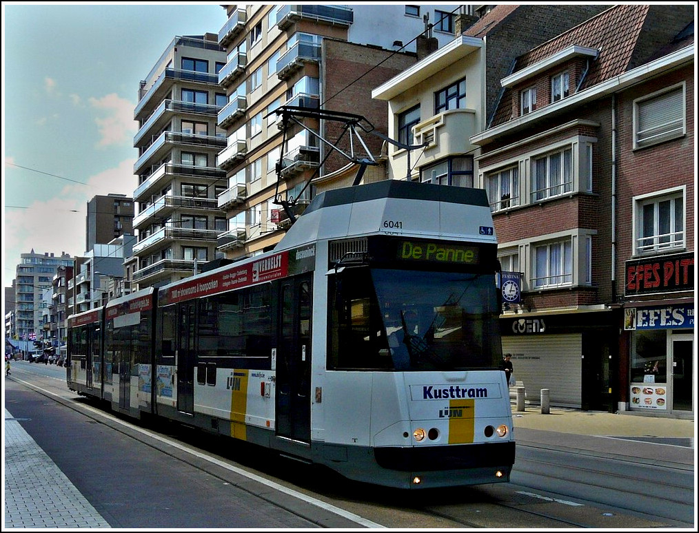 De Kusttram N6041 is running through Middelkerke Bad on July 23rd, 2011. 