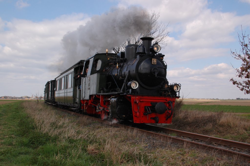 Eastersunday the 8th of april 2012, I took this photo of the steamengine No. 20 of the museum railway IHS Selfkantbahn at the most western part of Germany. It is an  5.5 Km long in linedistance museum railway company, with there end and begining stations Gillrath and Schierwaldenrath near the city of Geilenkirchen. They present a lot of narrow gauge locomotivs, passangercars mostly the are 3rd. class coaches with woodenbanches and coalstoves and frightcars of the 19th and 20th century. While a ride on this railway between the eastersunday and last week of october you've got the feeling, that you where gone back to the early years of the 20th century .