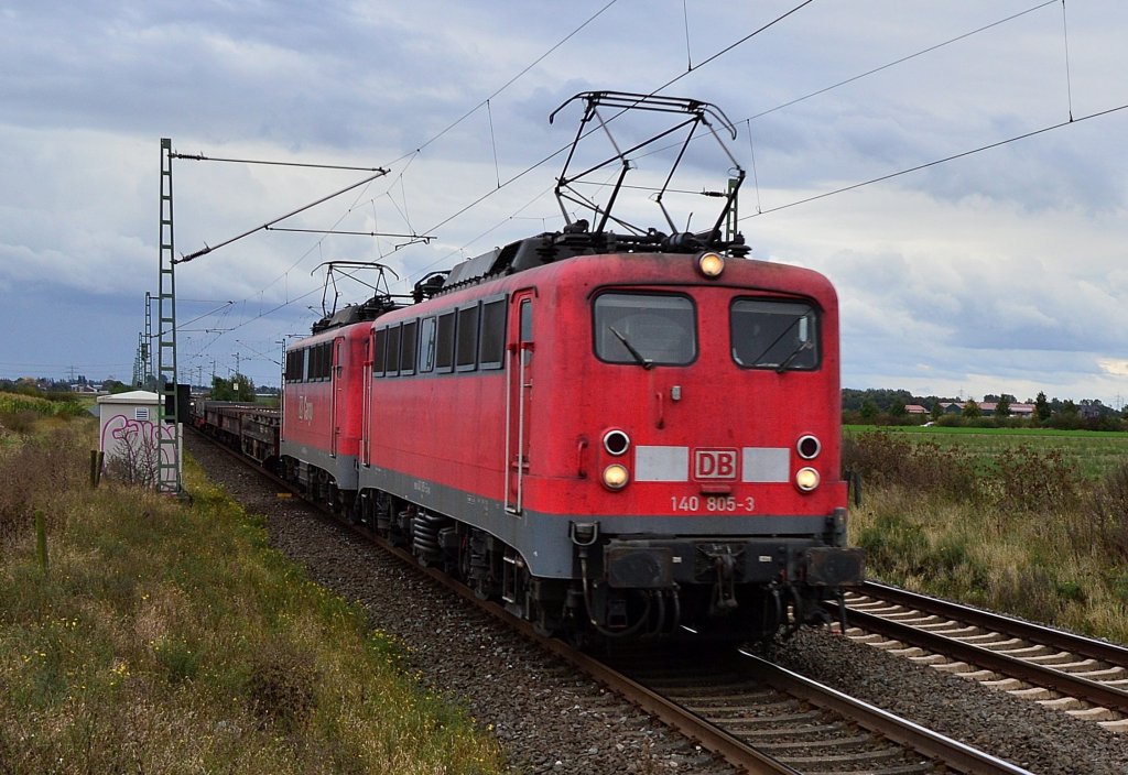 From the plattform at the stopstation Allerheiligen near Neuss, I made this photo from those old class 140 doubeltraction pulled steelcoilcartrain. The electriclelocomotives are the class 140 805-3 and the 140 806-1. Wensday 3.10.2012