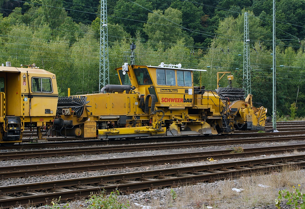 German Plasser Ballast Distributing and Profiling Machine SSP 110 SW (heavy vehicle no. 97 16 40 531 18-4) of the Schweerbau, at the 12.08.2011 parked in Betzdorf/Sieg.