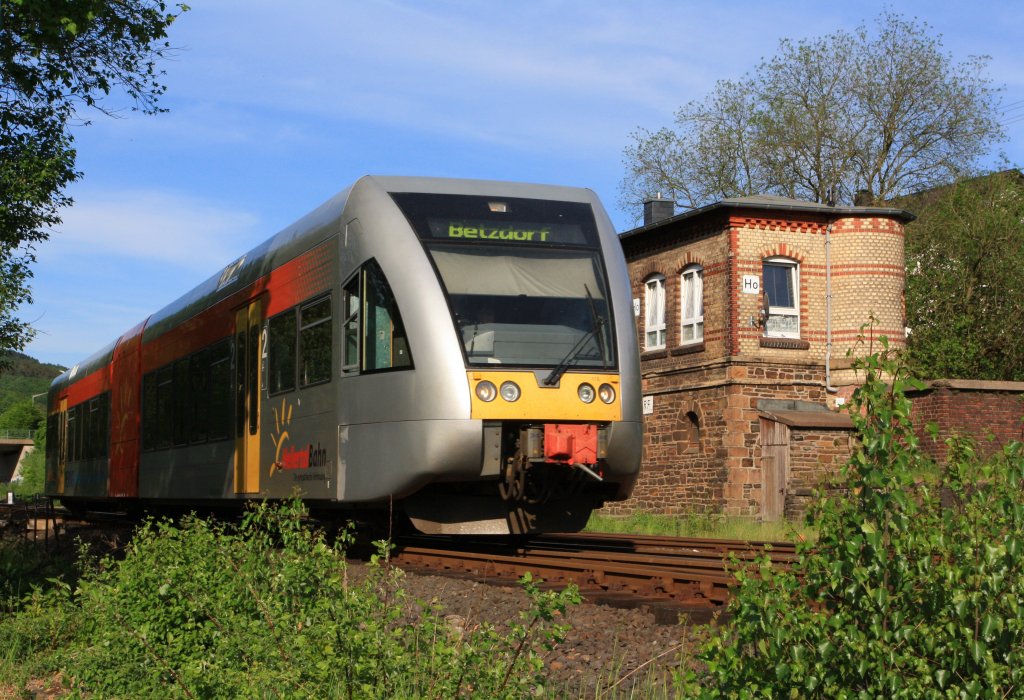 Hellertalbahn (Hellervalley Railway) with Stadler GTW 2/6 (Diesel multiple units) has left the signal box Herdorf east on 08.05.2011 and continue towards station Herdorf (Germany).