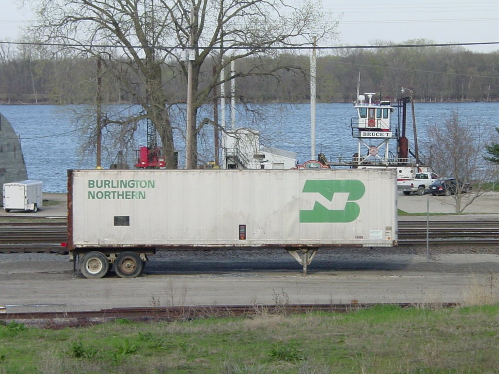 Here is an old aluminum sided semi trailer with Burlington Northern markings. I think it is an old CB&Q 40 foot model, not positive. Sitting at the Burlington, Iowa yard 9 Apr 2005. Mississippi River in the background.