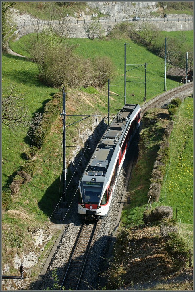 Local train to Interlaken Ost by Niederreid. 
09.04.2011