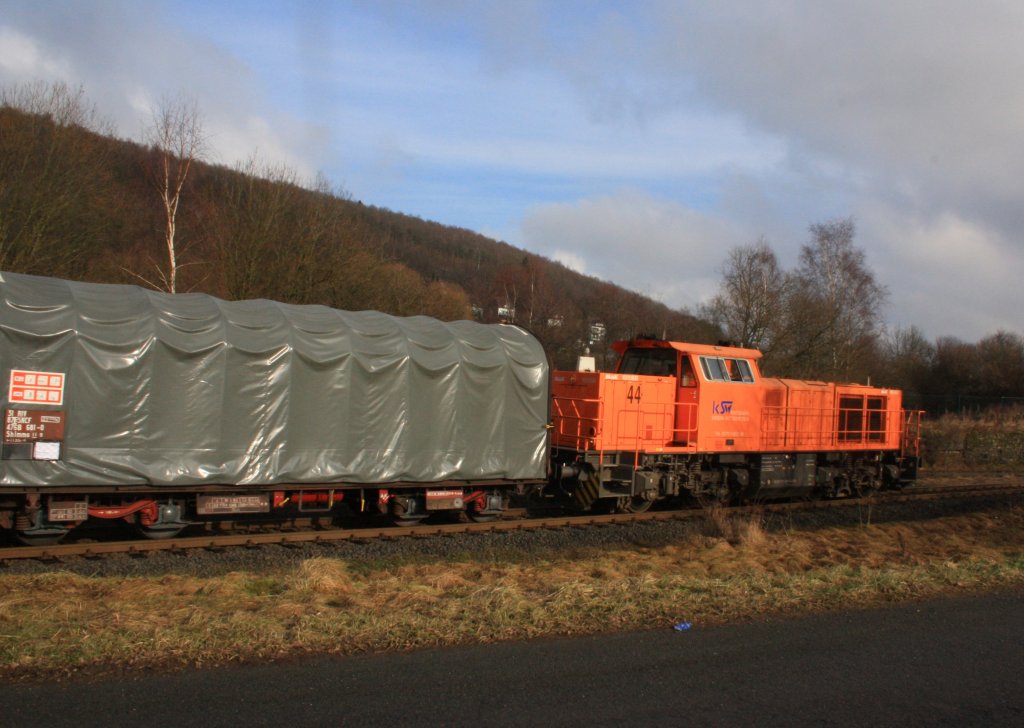 Locomotive 44 of the Kreisbahn Siegen-Wittgenstein (KSW) with a full coil freight train moves on 26.01.2011 in Neunkirchen-Struthtten to private track of the KSW, in the direction Neunkirchen-Salchendorf. Where on the Pfannenberg a large sheet metal working factory is. The locomotive is a MaK G 1000 BB, built in 2003.
