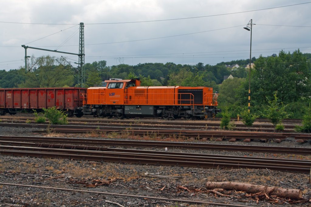 Locomotive 46 (MaK G 1700 BB) of the Kreisbahn Siegen-Wittgenstein (KSW) with freight train travels on 17.06.2011 at Scheuerfeld / Sieg, in the direction of Siegen.