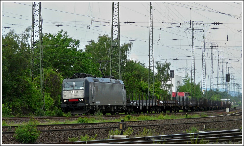 MRCE 185 553-5 is hauling a freight train through Koblenz Ltzel on May 22nd, 2011.