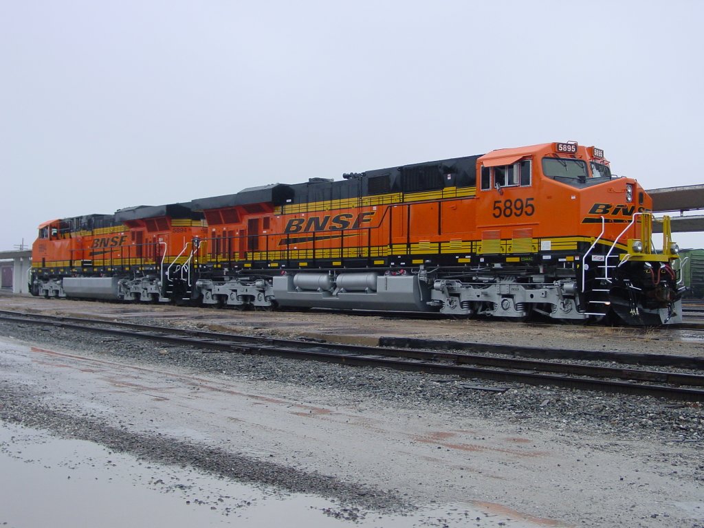 Nearly brand new, BNSF units 5894 & 5895 sit at the siding near the Burlington, Iowa depot. Locomotives are parked here while their coal train is being unloaded at the power plant 5 miles south of town. 9 Mar 2006.