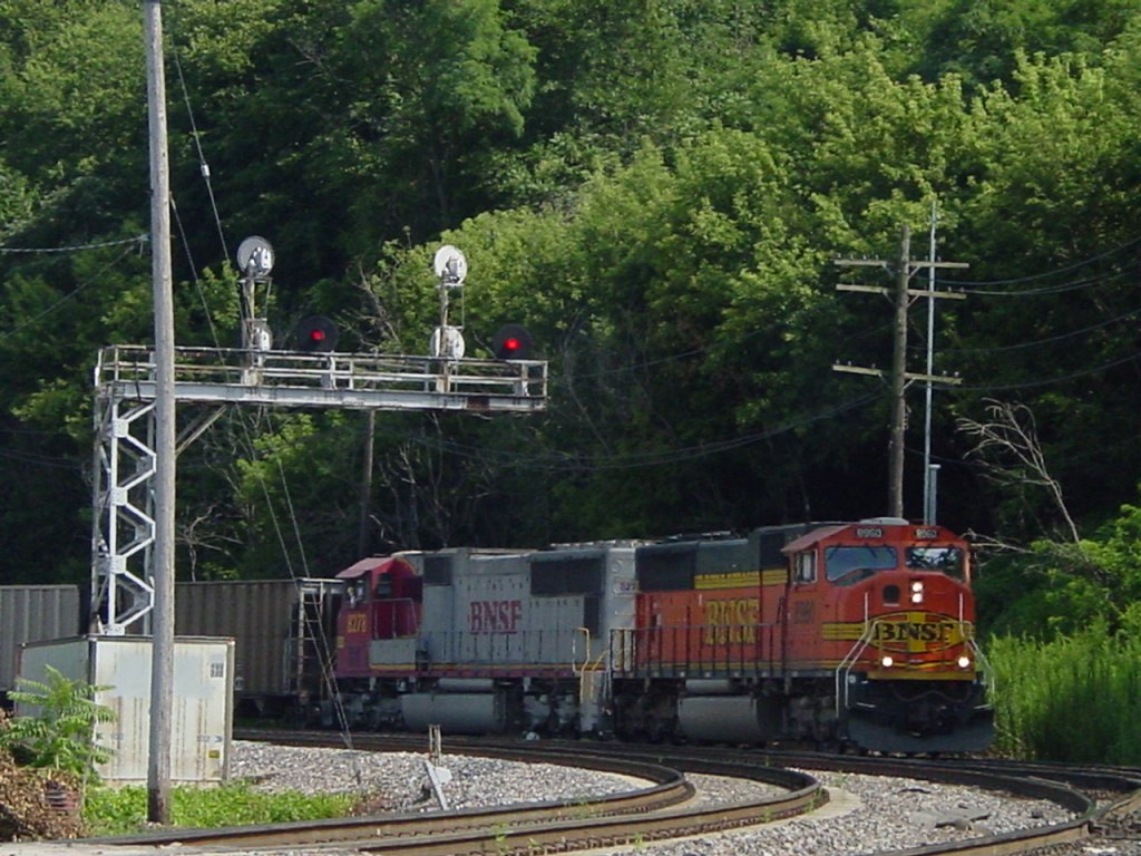 Northbound BNSF 8960 and Santa Fe 8278 pull an empty coal train from the  K Line  on 30 July 2003. The engineer is hanging out of the Santa Fe unit, maybe there is a problem with the old lok.